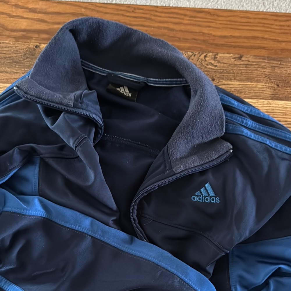 Adidas Blue Performance Jacket with Zip-Up Style and Folded Collar